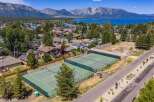 Experience luxury living with this stunning aerial view showcasing pristine tennis courts, perfect for active lifestyles.