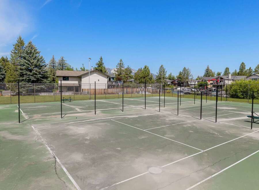 Enjoy an active lifestyle with this property's multiple tennis courts, perfect for friendly matches or serious training.
