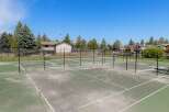 Enjoy an active lifestyle with this property's multiple tennis courts, perfect for friendly matches or serious training.