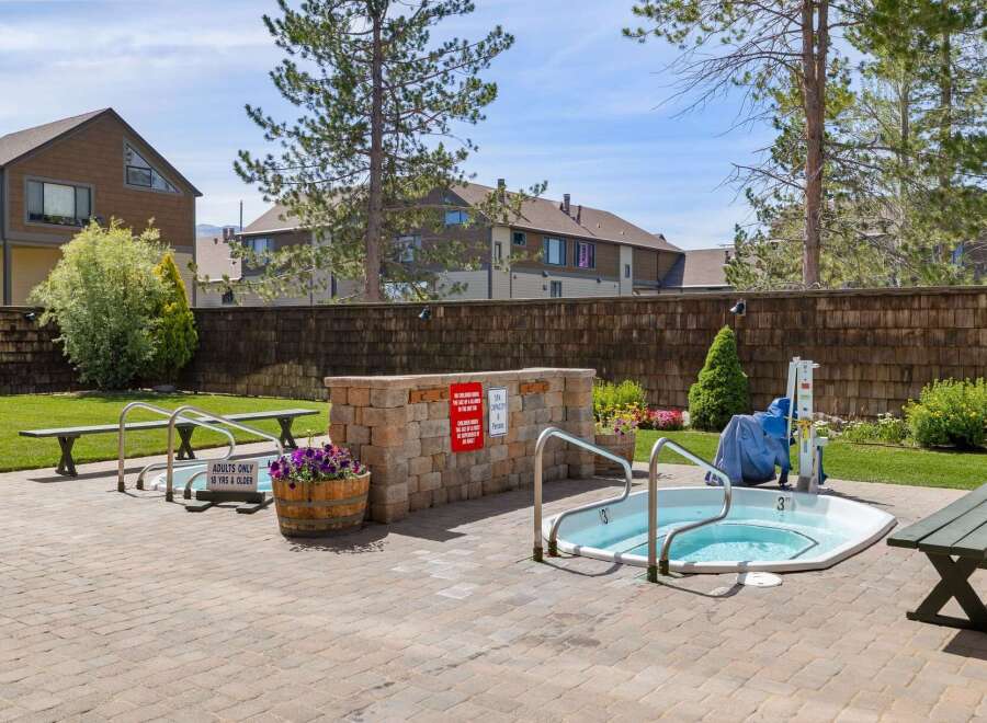 Enjoy a relaxing soak in this inviting hot tub, perfect for unwinding after a long day.