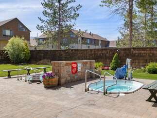 Enjoy a relaxing soak in this inviting hot tub, perfect for unwinding after a long day.