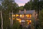 Nestled amidst a serene forest, this multi-level home offers a luxurious mountain retreat.