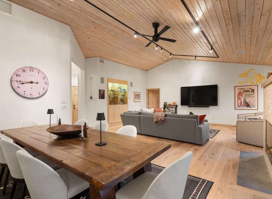 Experience sophisticated living in this spacious open-concept living and dining area, perfect for entertaining.