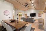 Experience sophisticated living in this spacious open-concept living and dining area, perfect for entertaining.