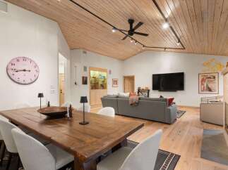 Experience sophisticated living in this spacious open-concept living and dining area, perfect for entertaining.