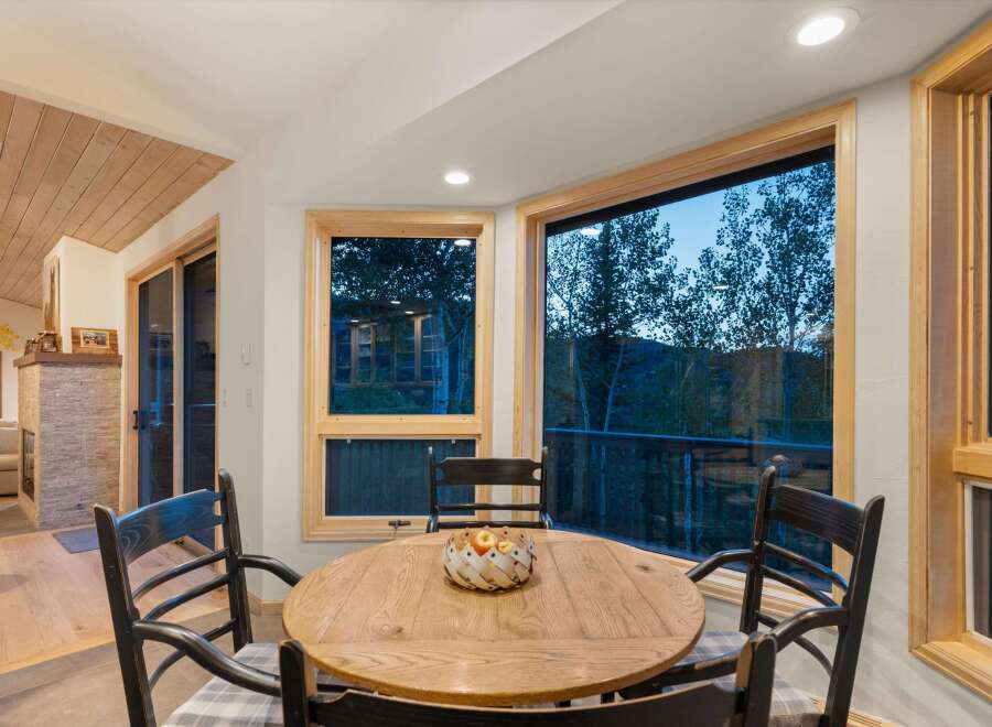 Enjoy breathtaking mountain views from this charming dining area, perfect for intimate meals or lively gatherings.