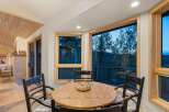 Enjoy breathtaking mountain views from this charming dining area, perfect for intimate meals or lively gatherings.