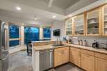 Experience breathtaking mountain views from this stunning kitchen, featuring a large bay window that floods the space with natural light.