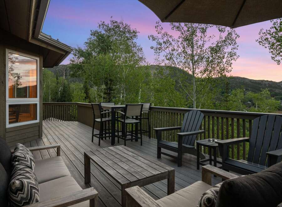 Enjoy breathtaking mountain views from this expansive deck, perfect for entertaining or relaxing.