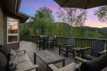 Enjoy breathtaking mountain views from this expansive deck, perfect for entertaining or relaxing.