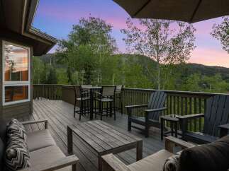 Enjoy breathtaking mountain views from this expansive deck, perfect for entertaining or relaxing.