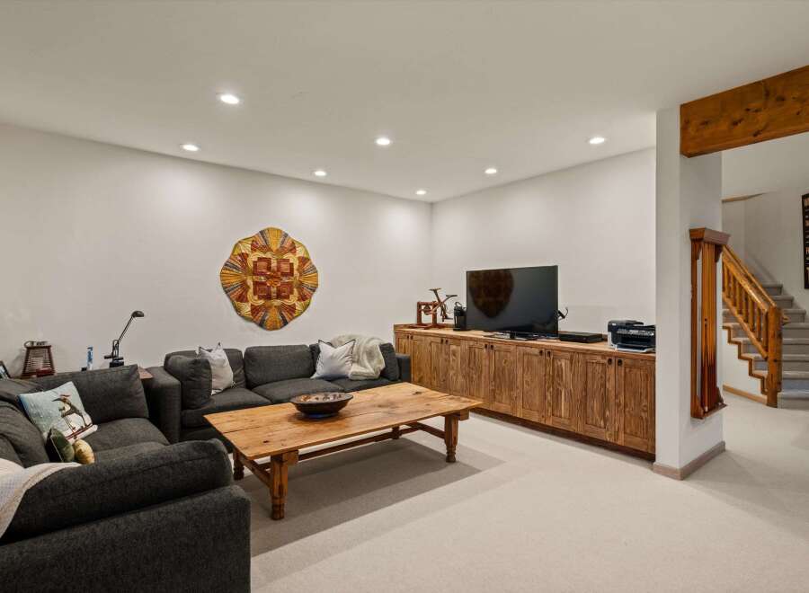 Discover this inviting basement living area, perfect for relaxation and entertainment.