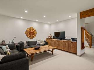 Discover this inviting basement living area, perfect for relaxation and entertainment.