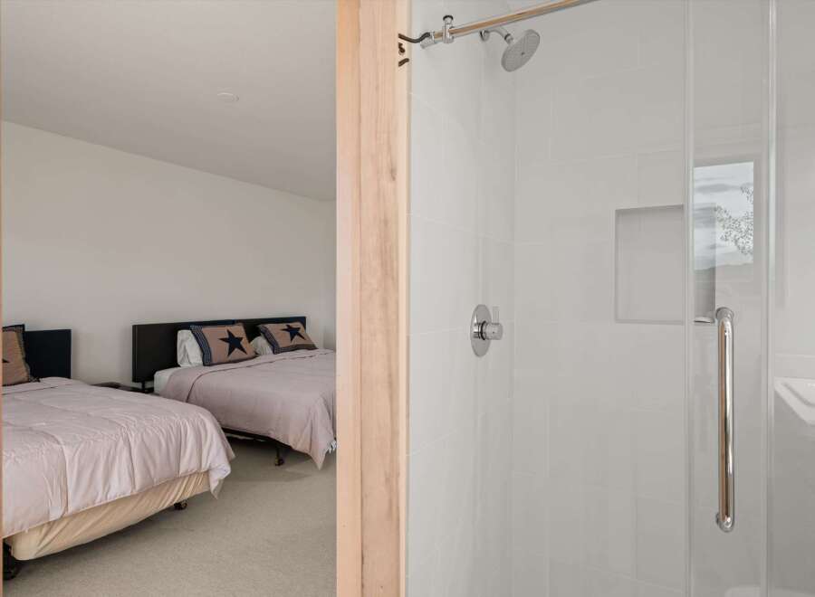 This inviting bedroom features two comfortable beds, perfect for accommodating guests or family.