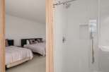This inviting bedroom features two comfortable beds, perfect for accommodating guests or family.