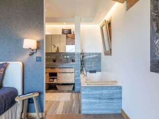 Experience luxury and comfort in this stunning bedroom featuring a spacious en-suite bathroom.