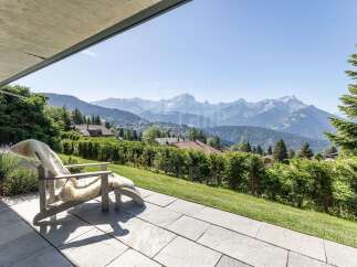 Experience breathtaking mountain vistas from this stunning property's expansive patio, perfect for enjoying the serene alpine landscape.