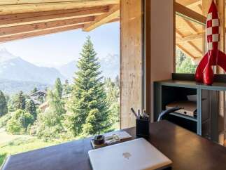 Experience breathtaking mountain views from this stunning property, featuring expansive windows that bring the outdoors in.