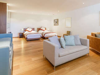 This spacious bedroom features two comfortable twin beds, perfect for guests or family.