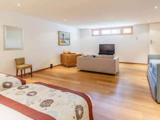 This spacious room features two comfortable beds with decorative bedding, perfect for guests or family.