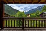 Experience breathtaking mountain views from this charming chalet, perfect for your next alpine getaway.