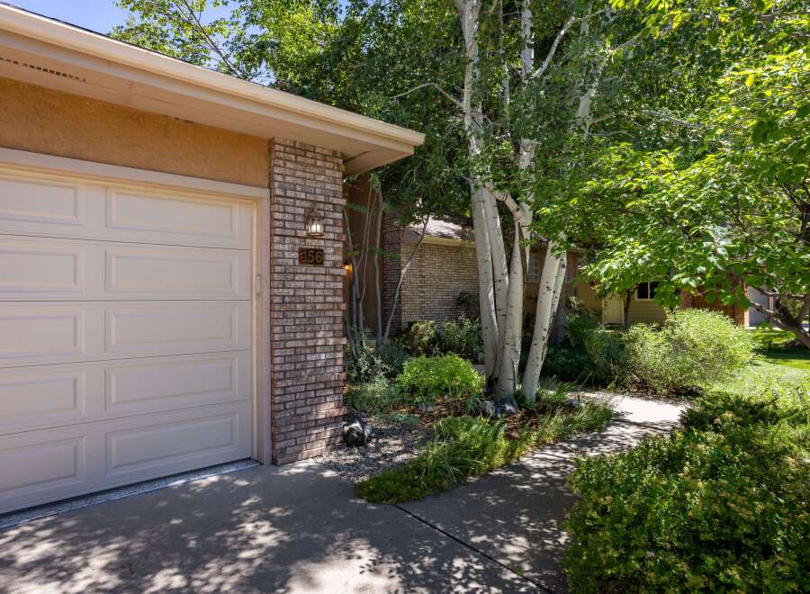 Welcome to this charming home featuring a classic brick exterior and a well-maintained garage door.