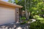 Welcome to this charming home featuring a classic brick exterior and a well-maintained garage door.