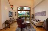 Experience the best of indoor-outdoor living in this stunning living room, featuring a grand fireplace and expansive sliding glass doors that open to a beautiful deck and backyard.