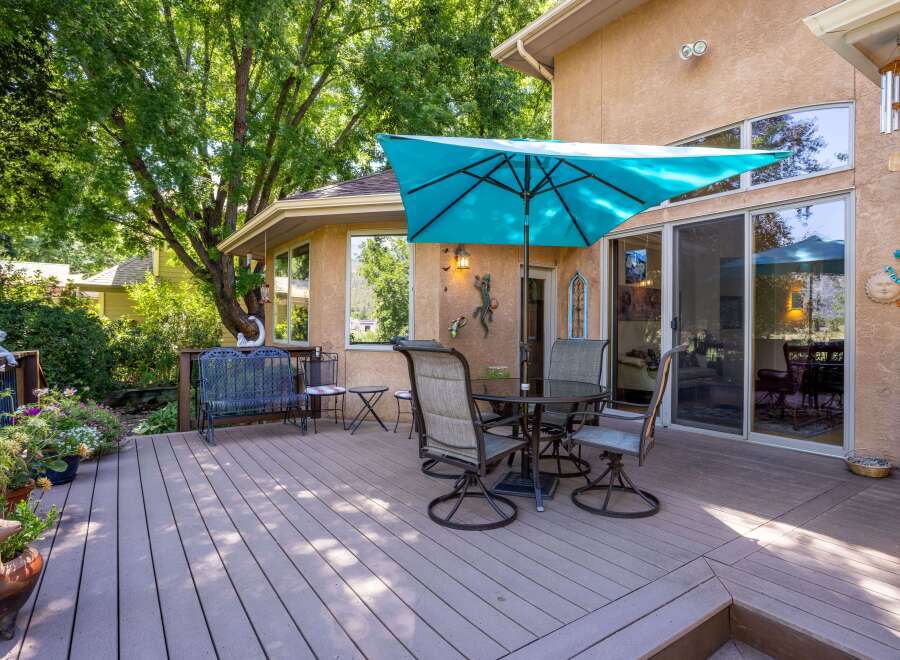 Enjoy outdoor living on this spacious deck, perfect for entertaining or relaxing.