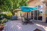 Enjoy outdoor living on this spacious deck, perfect for entertaining or relaxing.