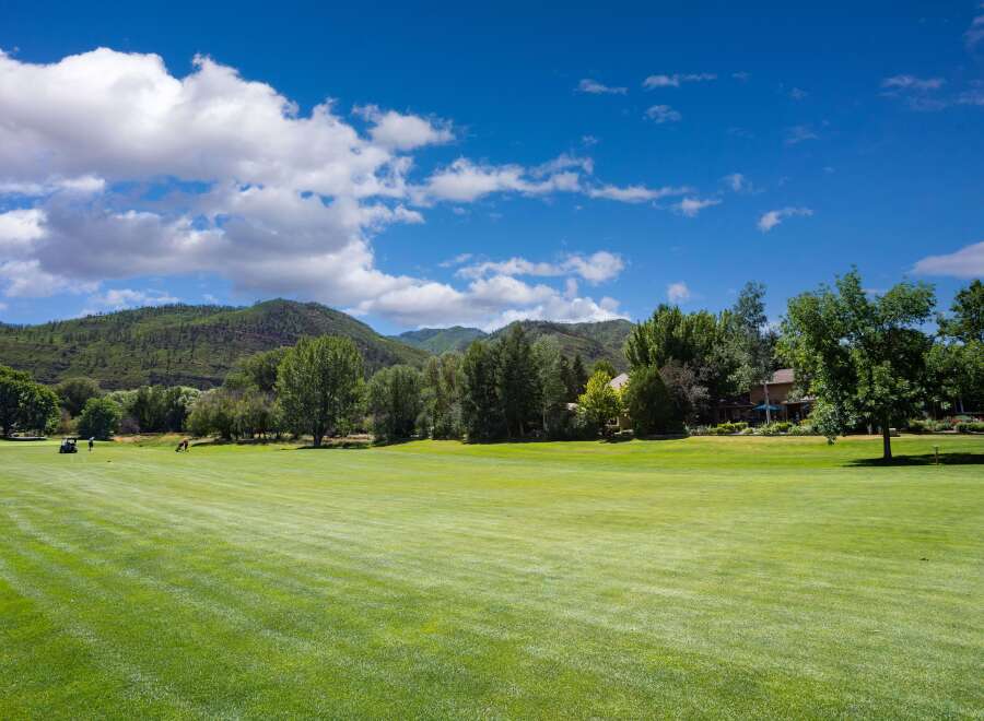 Experience luxury living with this stunning golf course view property, nestled against a backdrop of majestic mountains.