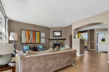 Step into this inviting living room, featuring a cozy fireplace and elegant decor.