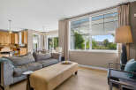Experience modern living in this spacious open-concept home, featuring a gourmet kitchen with rich wood cabinetry and a large island perfect for entertaining.