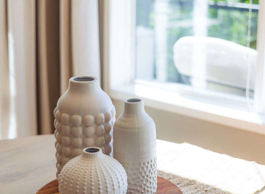 Enhance your home's aesthetic with these charming decorative vases, perfect for adding a touch of texture and style to any tabletop.