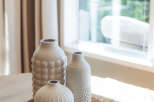Enhance your home's aesthetic with these charming decorative vases, perfect for adding a touch of texture and style to any tabletop.