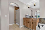 Step into this elegant bathroom featuring a spacious vanity with ample storage and a large mirror, perfect for your morning routine.
