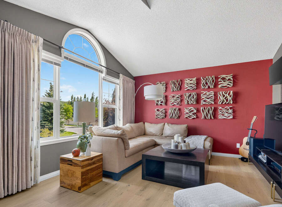 Experience modern living in this spacious living room, featuring a large sectional sofa perfect for gatherings.
