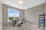 This home office space features a large window with a scenic view, perfect for natural light and inspiration.