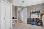Discover a versatile space perfect for a home office or study nook, featuring a built-in desk with ample storage.