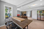 This finished basement offers a fantastic entertainment space, complete with a shuffleboard table and a foosball table.