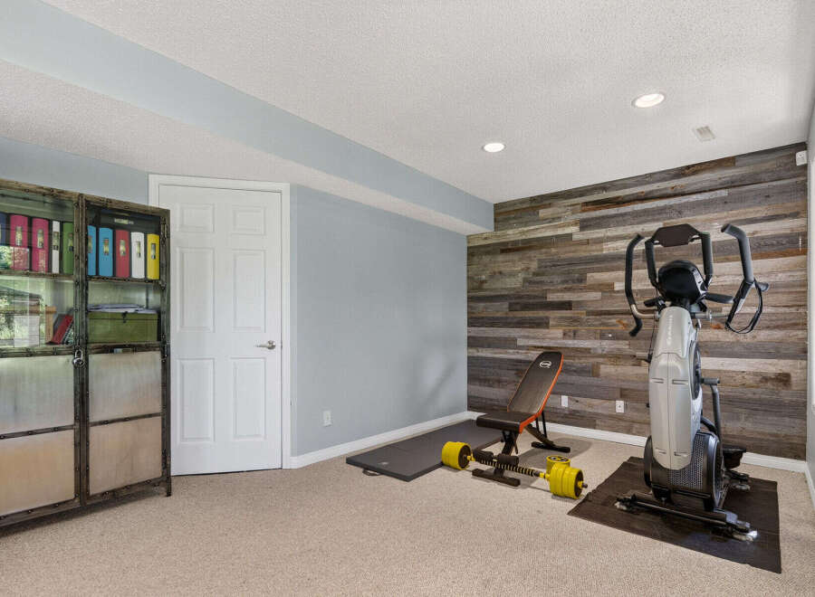 Transform your home into a personal fitness sanctuary with this dedicated workout space.