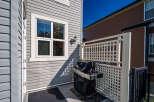 Enjoy outdoor living with this charming patio space, complete with a gas grill perfect for summer cookouts.