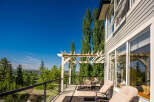 Enjoy breathtaking views from this expansive deck, perfect for entertaining or relaxing.