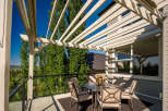 Enjoy outdoor living on this spacious deck, perfect for entertaining or relaxing.