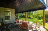 Enjoy outdoor living on this covered patio, perfect for entertaining or relaxing in any weather.