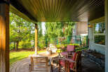 Enjoy outdoor living in this covered patio space, perfect for relaxing or entertaining.