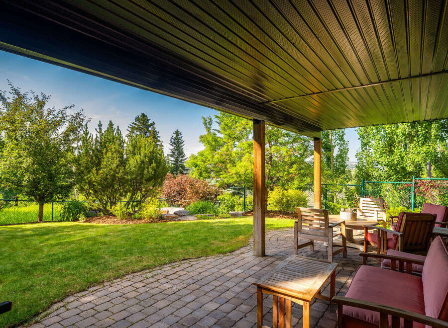 Enjoy outdoor living on this covered patio, perfect for entertaining or relaxing.