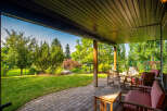 Enjoy outdoor living on this covered patio, perfect for entertaining or relaxing.