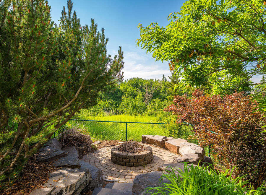 Enjoy outdoor living with this charming fire pit area, perfect for gathering with friends and family.