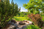 Enjoy outdoor living with this charming fire pit area, perfect for gathering with friends and family.